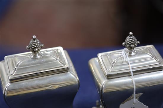 A pair of Victorian silver bombe shaped tea caddies by Henry Wilkinson & Co, 17.5 oz.